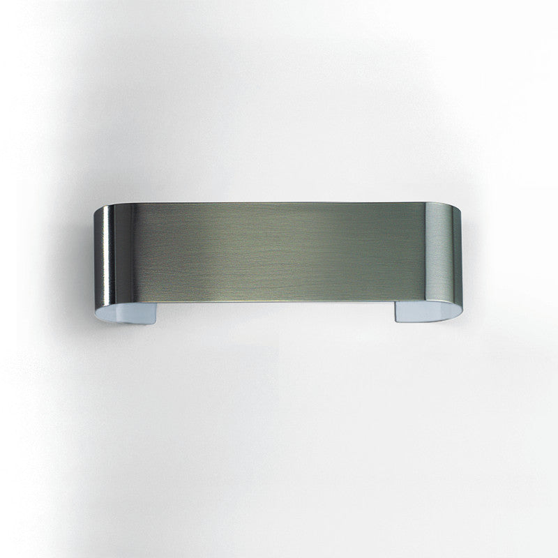 Eco Wall Light by Zaneen Shop - A brushed nickel wall lamp with a subtle oval design. 