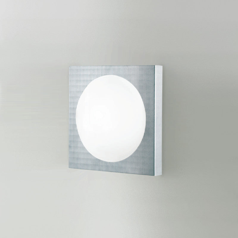 Dome Wall Light by Zaneen Shop - A silver gray colored square shape light fixture that feature a circular light source in the center within a rectangular shape. Made of glass and aluminum.  