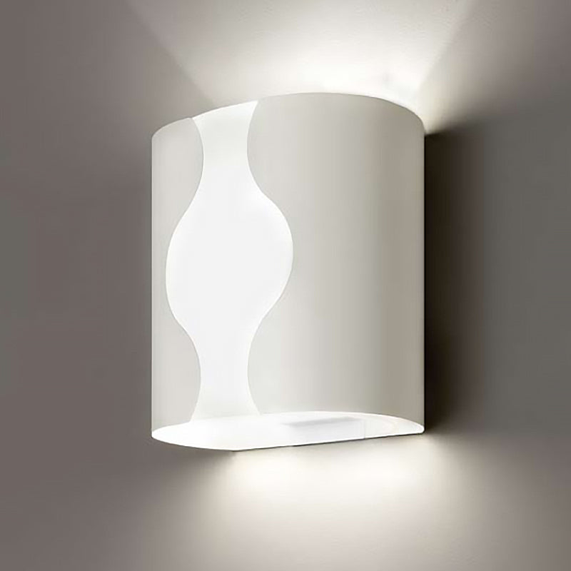 Wall Light by Zaneen Shop - A white colored cylinder-shaped wall lamp with a unique wave cutout design down the center.