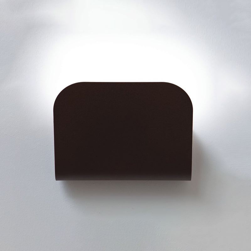 Tasca Wall Light by Zaneen Shop - A cylinder-shape wall a lamp with a wave cut-out design.