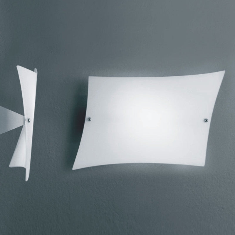 Lucilla Wall Light by Zaneen Shop - A delicate wall lamp shaped as a slanted parallelogram that resembles a floating piece of paper. 