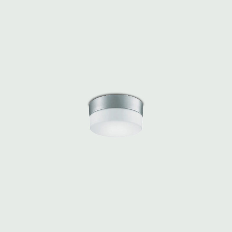 Flan Ceiling Light by Zaneen Shop - A Metallic gray disc shape light fixture with frosted glass center.
