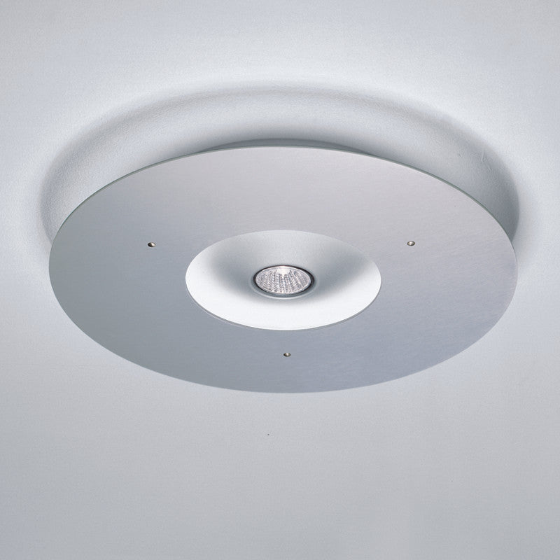 Ixion Ceiling Light by Zaneen Shop - A circular aluminum ceiling lamp.
