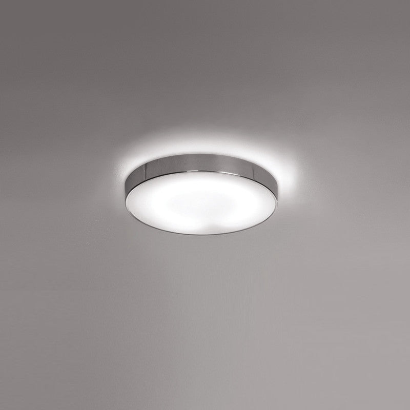 Inoxx Ceiling Light by Zaneen Shop - A circular ceiling lamp with a polished stainless steel finish.