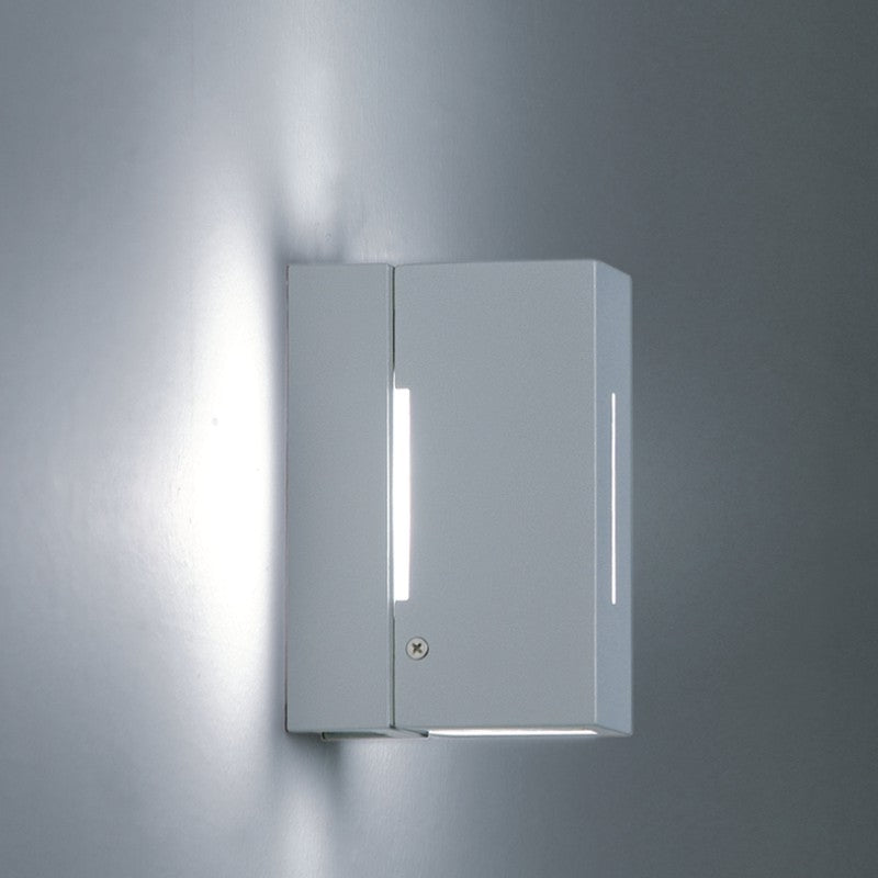 Bloc Wall Light by Zaneen Shop - A modern rectangular metal wall lamp with a slit design for indirect light output.