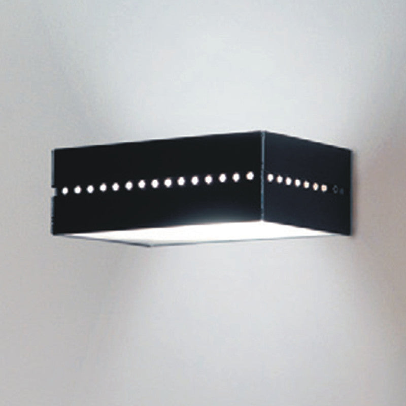 Linea Wall Light by Zaneen Shop - A A rectangle black wall light with both direct and indirect light due to the circular cutouts and shape of the fixture.