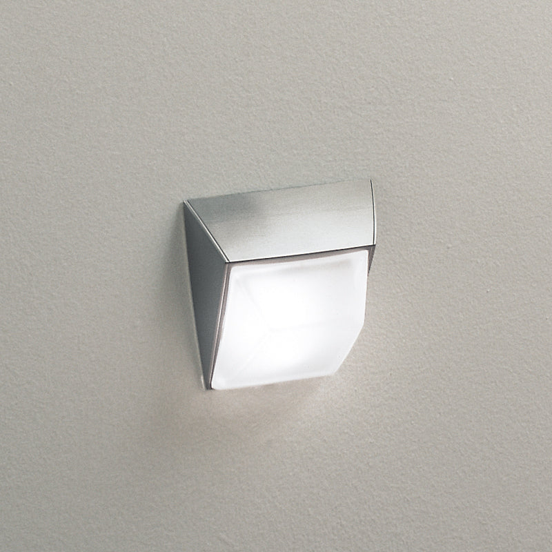 Odile Wall Light by Zaneen Shop - A brushed nickel wall lamp with a abstract square and tilted shape.